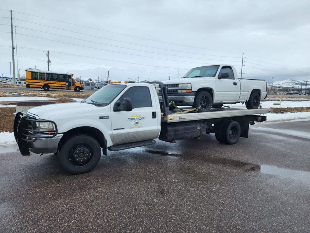 A-Plus tow truck hauling another truck